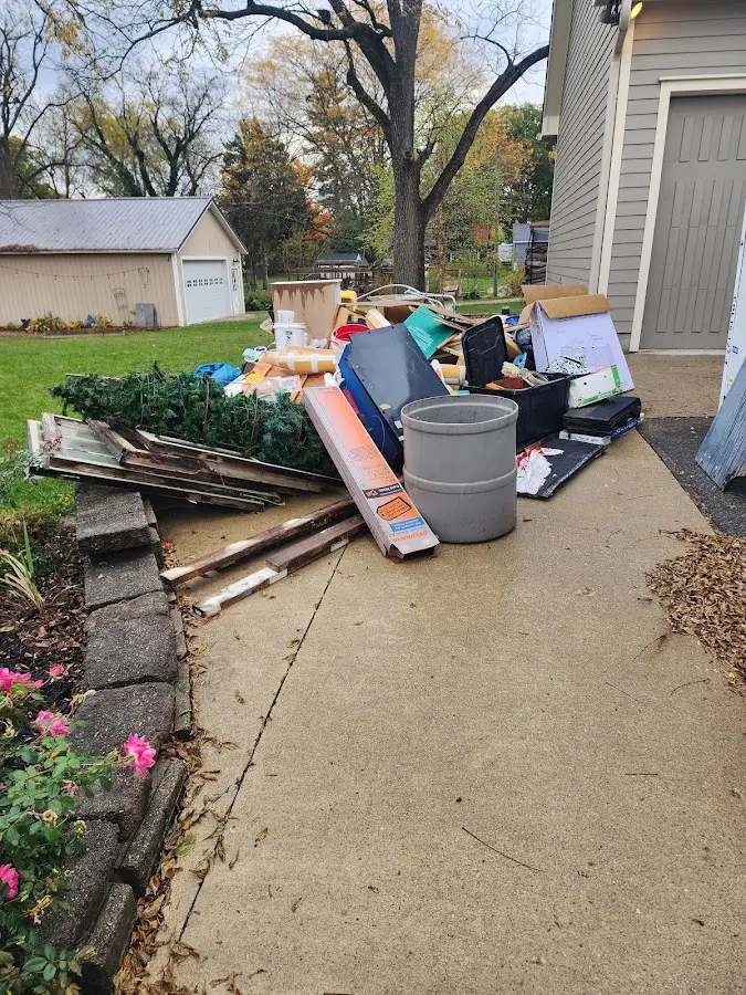 Dumpster being loaded with debris for Estate Cleanout Dumpster Rental in North Weeki Wachee